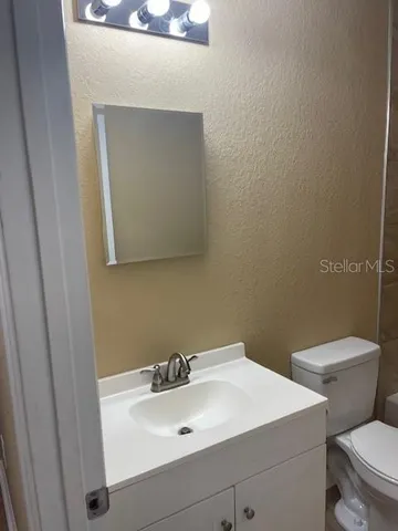 a bathroom with a sink and a toilet