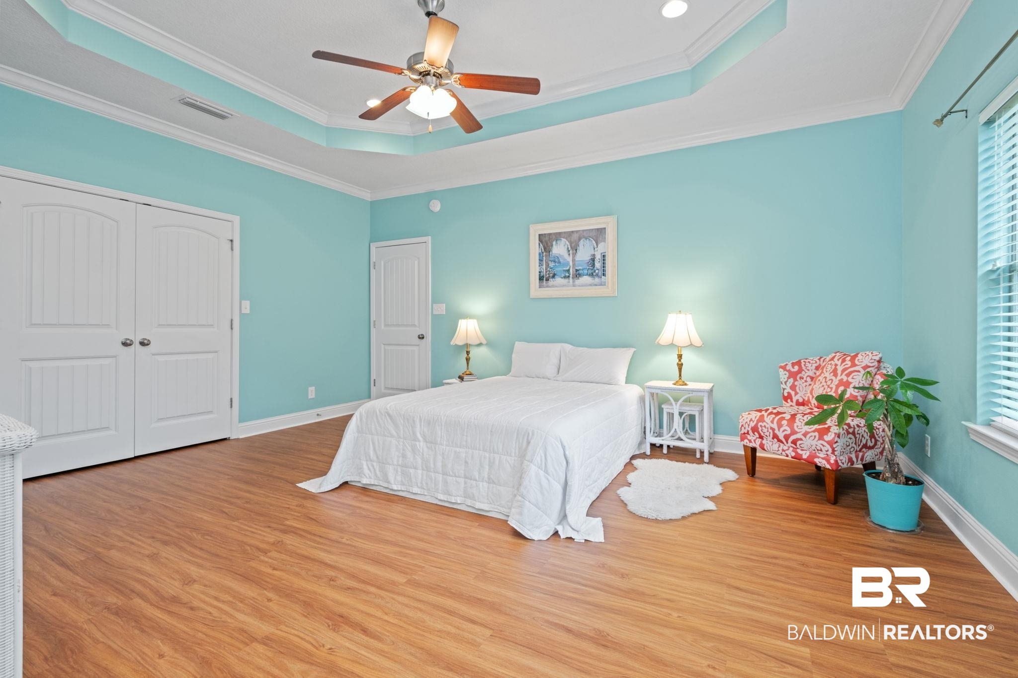 2554 Masters Court Mobile, AL 36618 - Photo 22 of 35 Bedroom featuring wood finished floors, a raised ceiling, crown molding, ceiling fan, and a closet