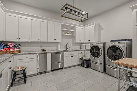 a kitchen with a stove top oven sink and cabinets