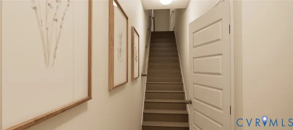 a view of staircase with white walls and white door