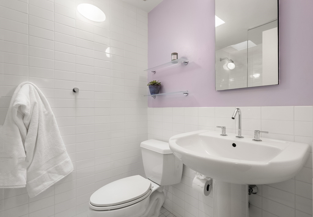 32 Moon Hill Road Lexington, MA 02421 - Photo 18 of 34 a bathroom with a sink a toilet and mirror