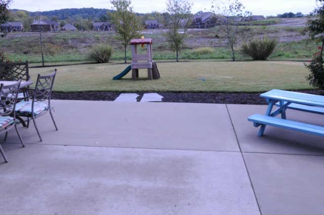 1007 Fulman Road Hendersonville, TN 37075 - Photo 14 of 17 Huge Concrete Patio with Big, Flat, landscaped back yard
