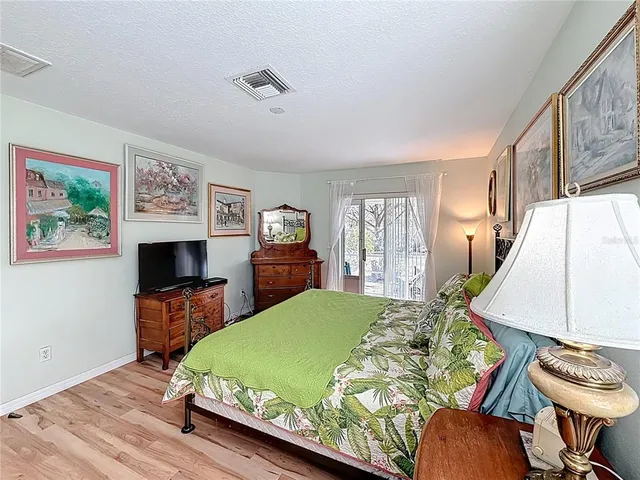 a bed room with furniture and a flat screen tv