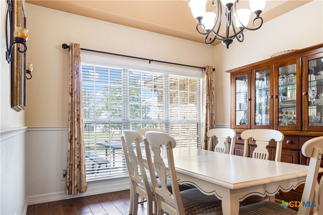 790 Spanish Grant Road Goliad, TX 77963 - Photo 11 of 41 a view of a dining room with furniture window and wooden floor
