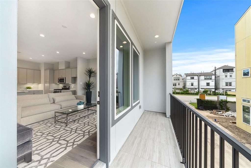 8411 Hempstead Road, Unit F Houston, TX 77008 - Photo 11 of 25 a view of a living room and a balcony