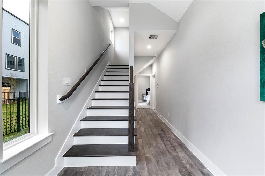 8411 Hempstead Road, Unit F Houston, TX 77008 - Photo 6 of 25 a view of entryway and hall with wooden floor