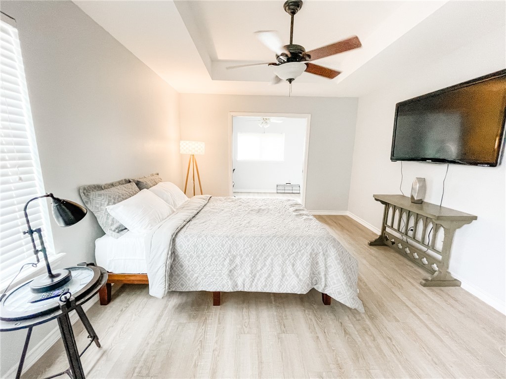 13901 Lighthouse Drive Corpus Christi, TX 78418 - Photo 22 of 38 a bedroom with a bed and a flat screen tv
