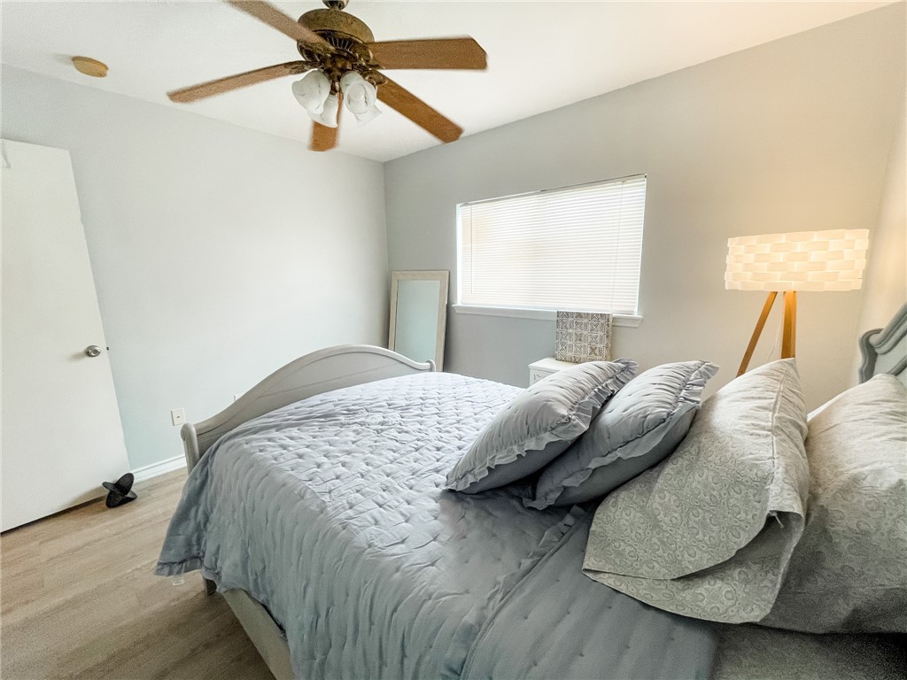 13901 Lighthouse Drive Corpus Christi, TX 78418 - Photo 30 of 38 a bedroom with a bed and window