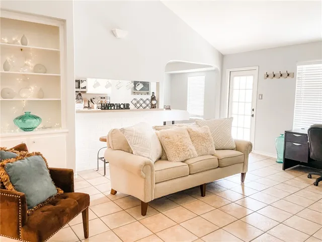 a living room with furniture and a window