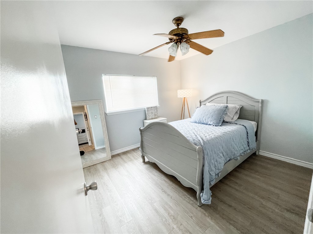 13901 Lighthouse Drive Corpus Christi, TX 78418 - Photo 31 of 38 a bedroom with a bed and a ceiling fan