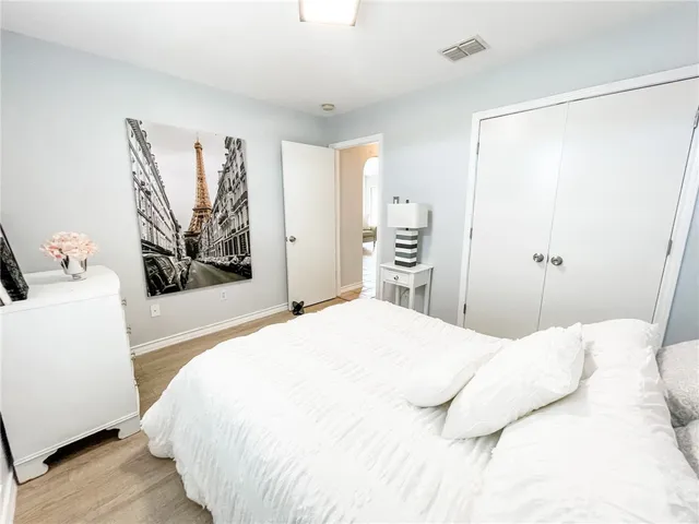 a bedroom with a bed and a couch