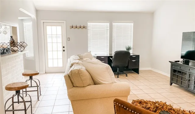 a living room with furniture and a window