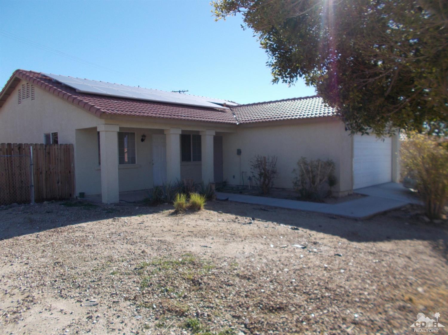 13080 Mountain View Road Desert Hot Springs, CA 92240 - Photo 1 of 11 a backyard of a house