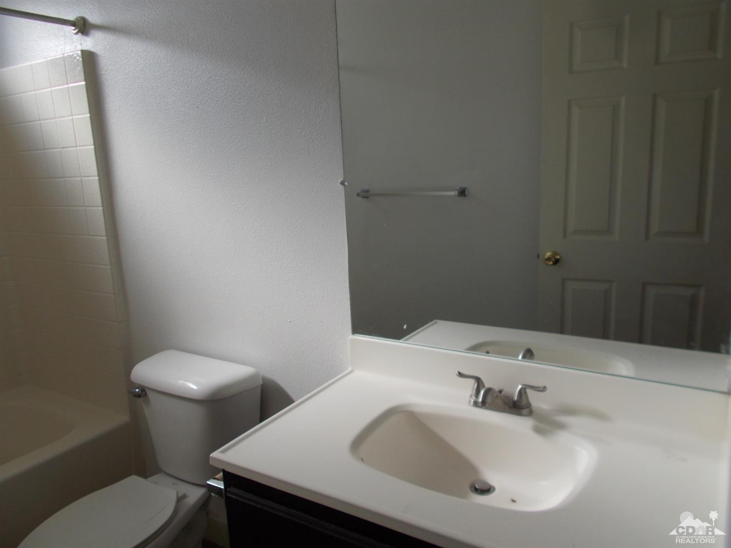 13080 Mountain View Road Desert Hot Springs, CA 92240 - Photo 6 of 11 a bathroom with a sink and a toilet