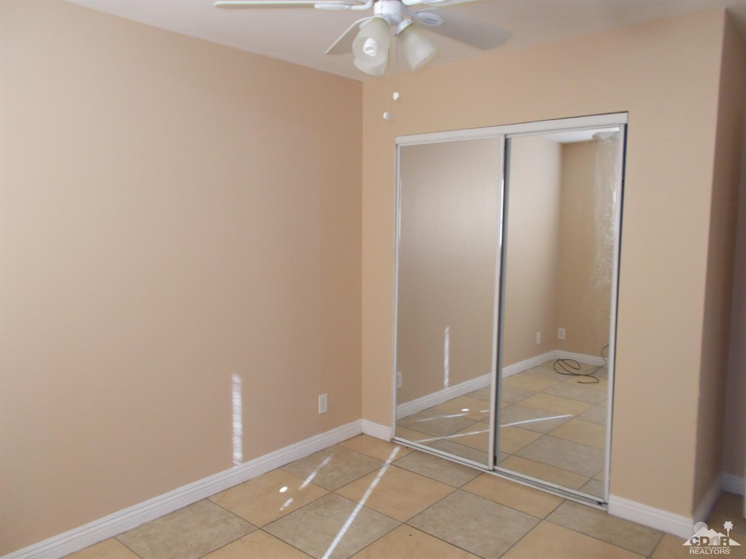 13080 Mountain View Road Desert Hot Springs, CA 92240 - Photo 7 of 11 a view of an empty room with window