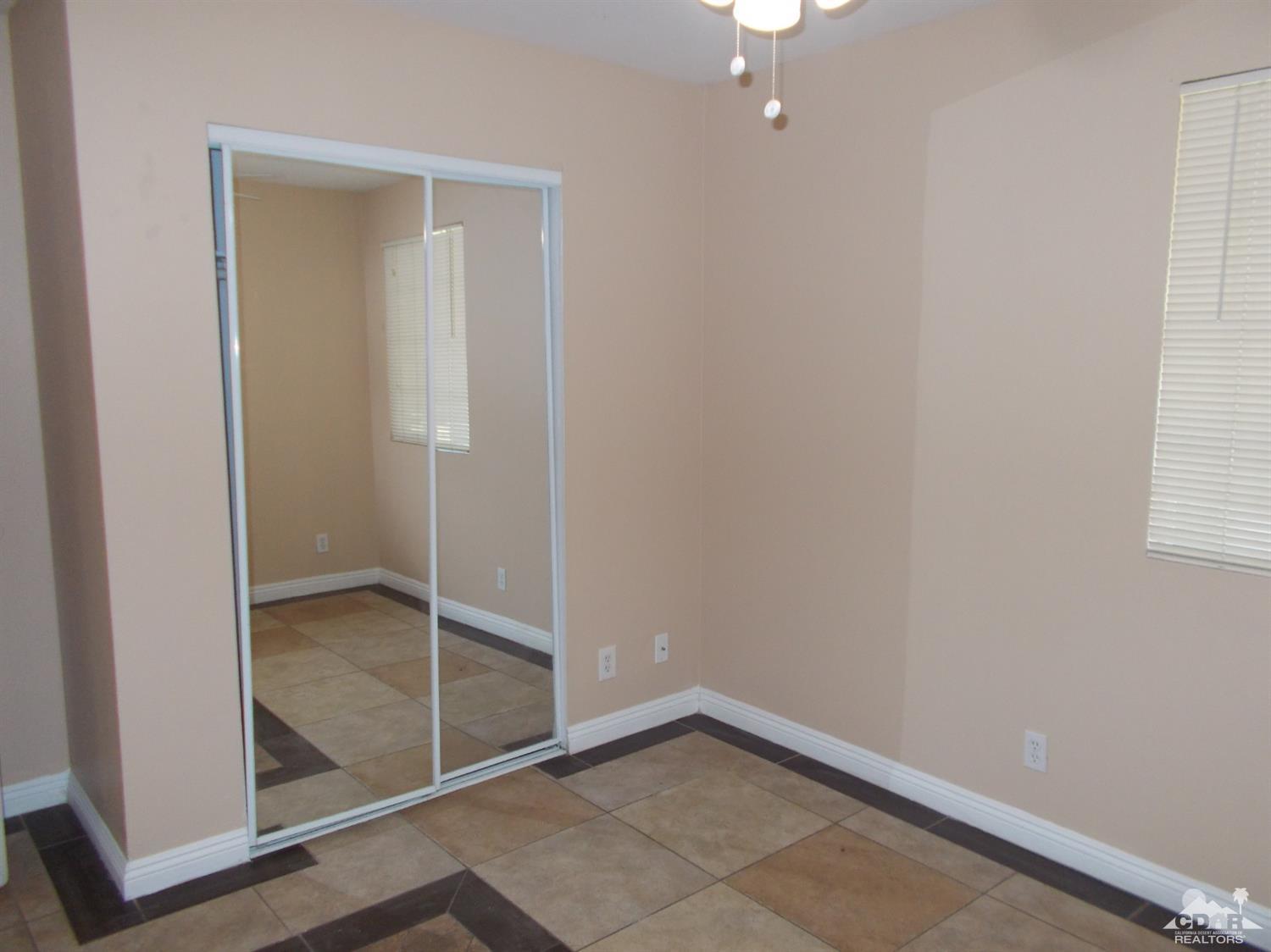 13080 Mountain View Road Desert Hot Springs, CA 92240 - Photo 10 of 11 an empty room with closet