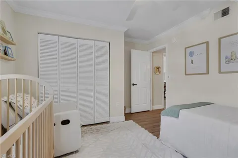 a spacious bedroom with a bathtub and shower