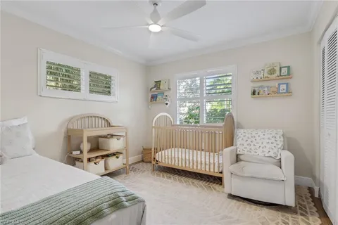 a bedroom with furniture and a window