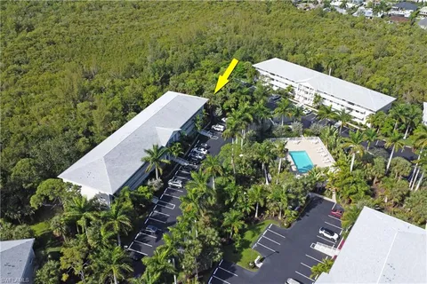 an aerial view of a house with a yard lake view and mountain view