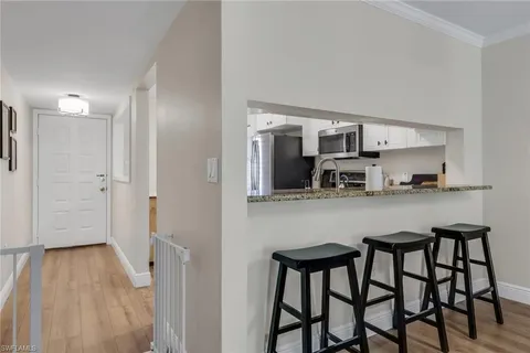 a kitchen with a table and chairs in it