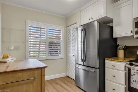 a kitchen with stainless steel appliances a refrigerator stove and sink