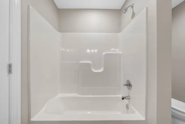 a close up of a bathtub curtain