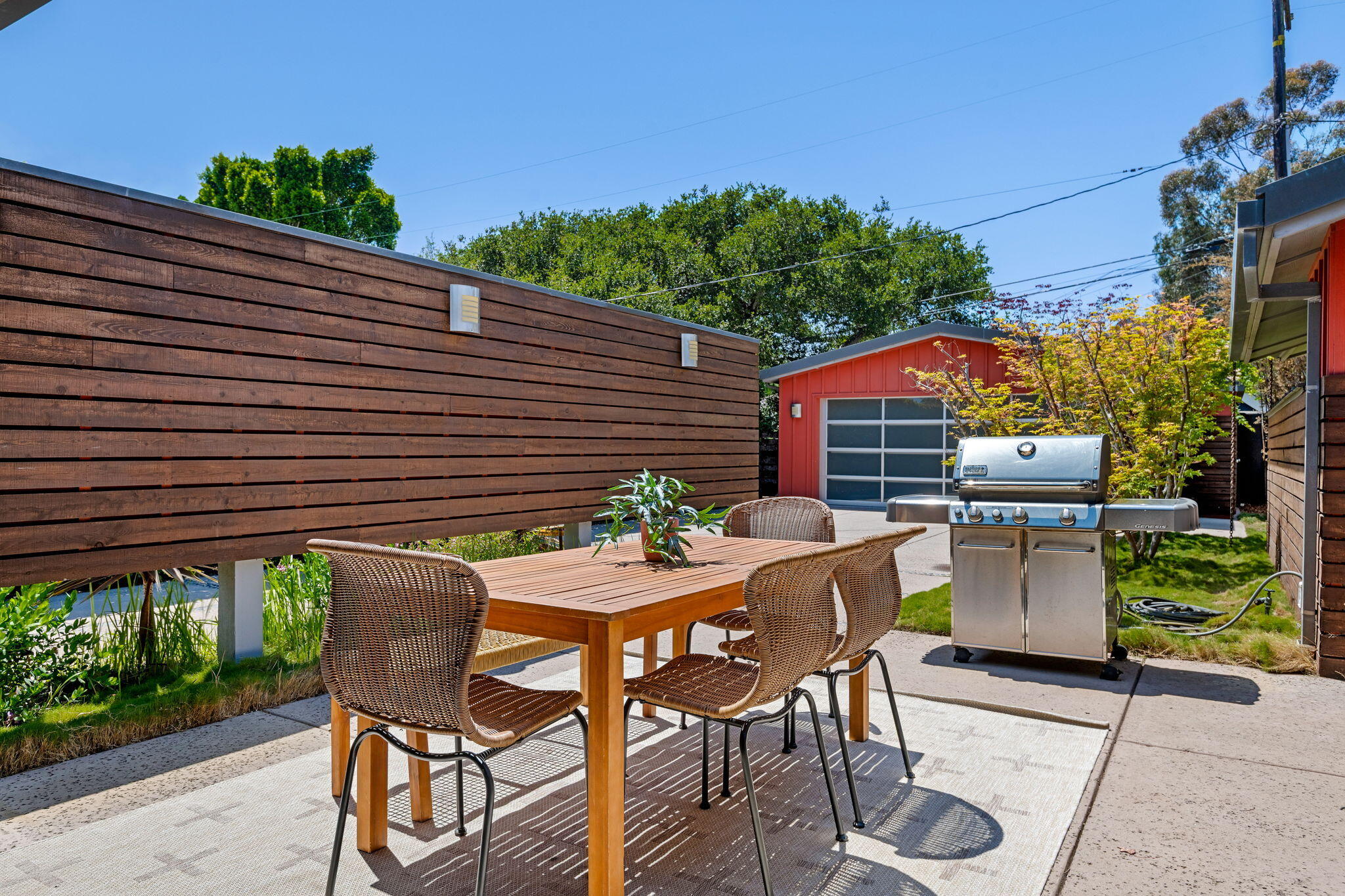 175 Hermosillo Road Montecito, CA 93108 - Photo 11 of 19 a patio with a table and chairs and potted plants