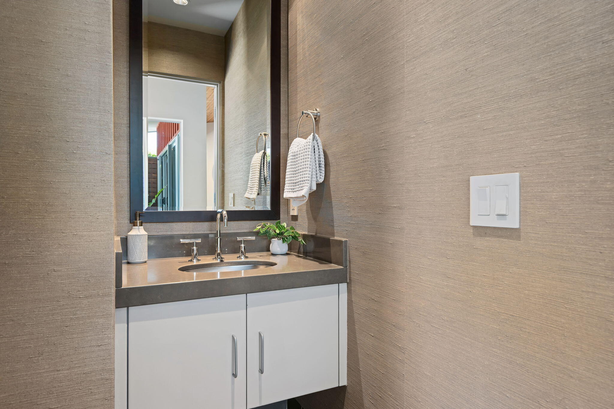 175 Hermosillo Road Montecito, CA 93108 - Photo 13 of 19 a bathroom with a sink and a mirror