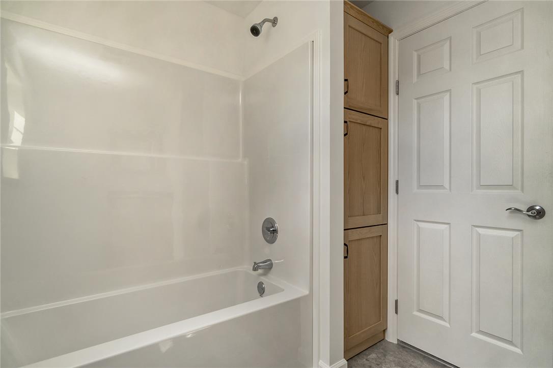 624 Main Road Lehighton, PA 18235 - Photo 28 of 42 A pristine tub and shower combination with ample adjacent storage offers practicality and comfort.