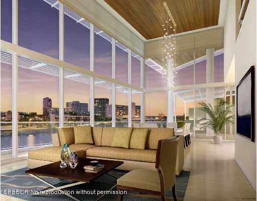 a view of a balcony with couches and lounge chairs