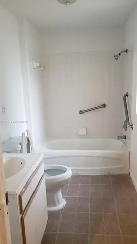 a view of a room with window and wooden floor