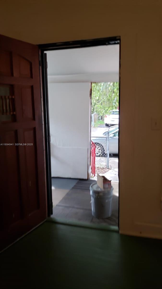 1517 Logan Street Jacksonville, FL 32209 - Photo 19 of 30 a view of empty room with wooden floor and fan