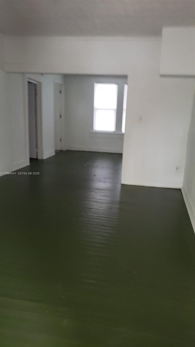 1517 Logan Street Jacksonville, FL 32209 - Photo 20 of 30 a view of room and hall with wooden floor