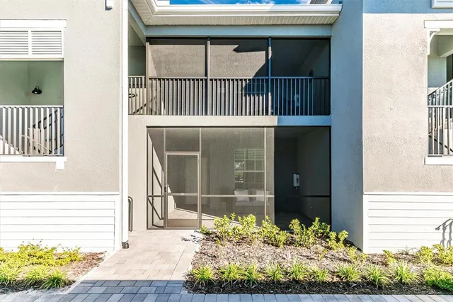 a view of a room with windows and cabinet