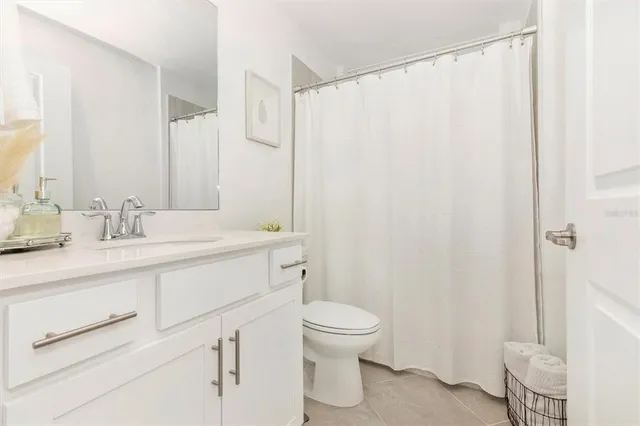 a view of a park with large trees