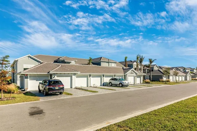a building with car parked in front of it