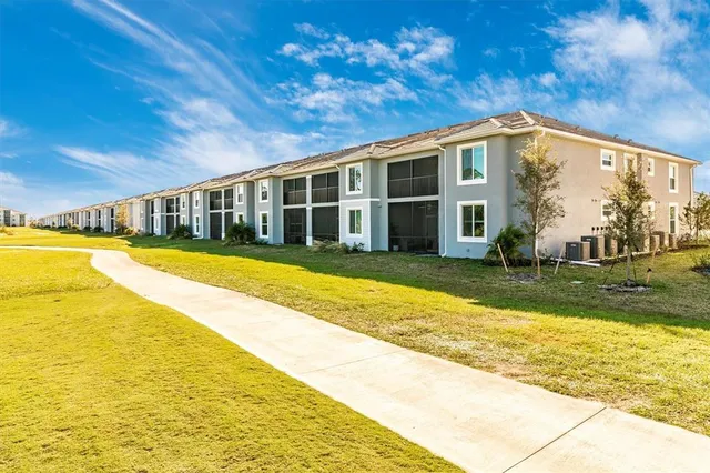 a view of a patio with a table and chairs