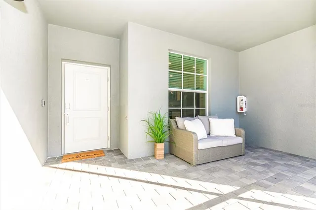 a view of a swimming pool with an ocean and trees