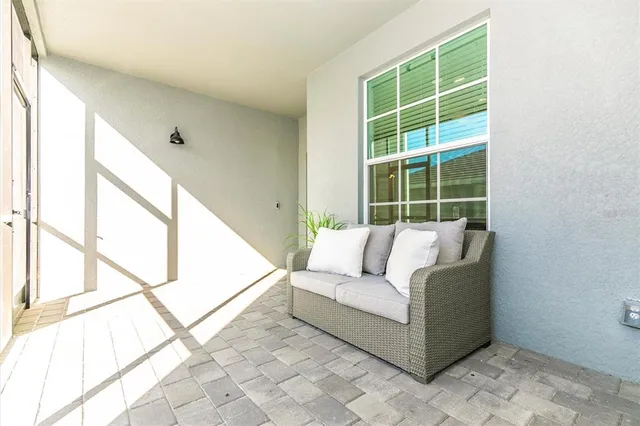 a dining room with lots of wooden furniture and a chandelier