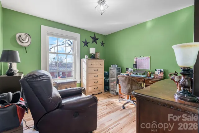 a workspace with furniture and a window