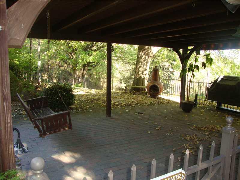 177 Strawcutter Road Derry, PA 15627 - Photo 22 of 25 Patio/Deck. Permanent Propane Grill, Swing, Bench, Flood and Specialty Lighting Everywhere and Awesome Flag Pole!