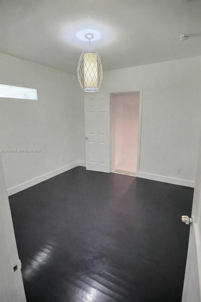 6541 Southwest 18th Street Miami, FL 33155 - Photo 13 of 22 wooden floor in an empty room