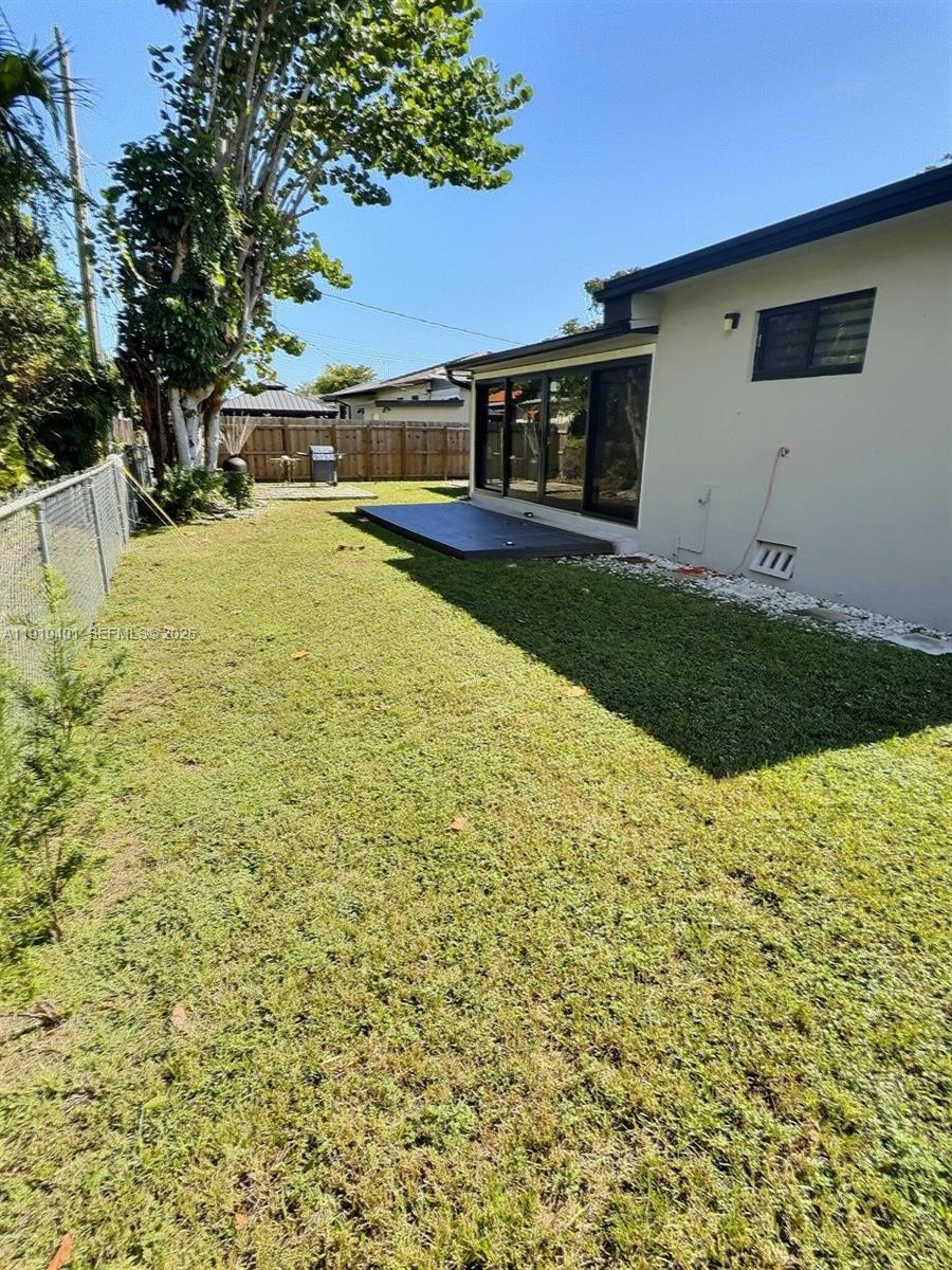 6541 Southwest 18th Street Miami, FL 33155 - Photo 18 of 22 a view of a house with a yard