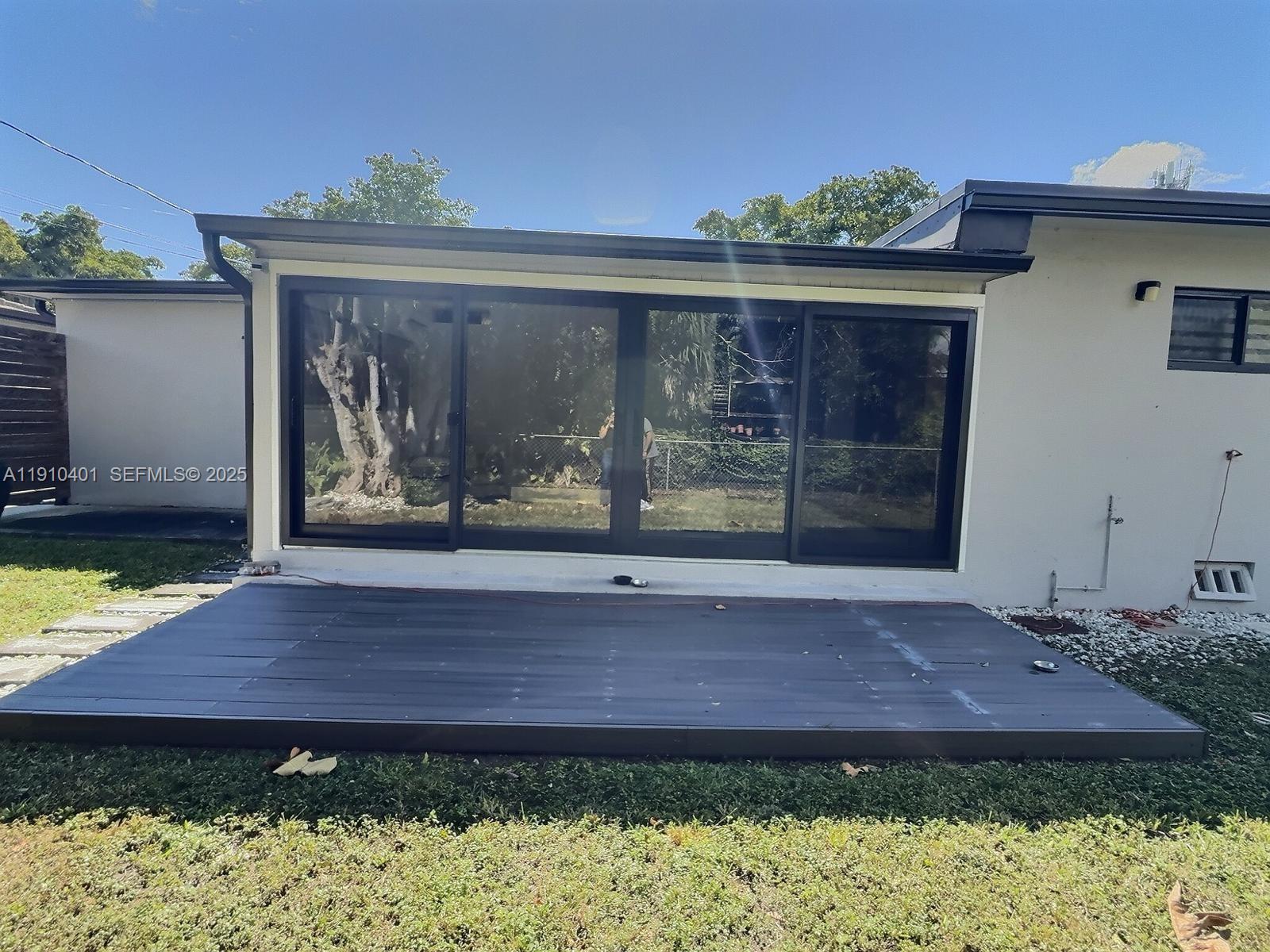 6541 Southwest 18th Street Miami, FL 33155 - Photo 20 of 22 a front view of a house with a yard