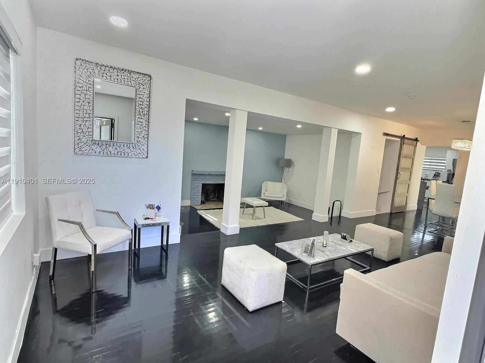 6541 Southwest 18th Street Miami, FL 33155 - Photo 2 of 22 a living room with furniture and a table