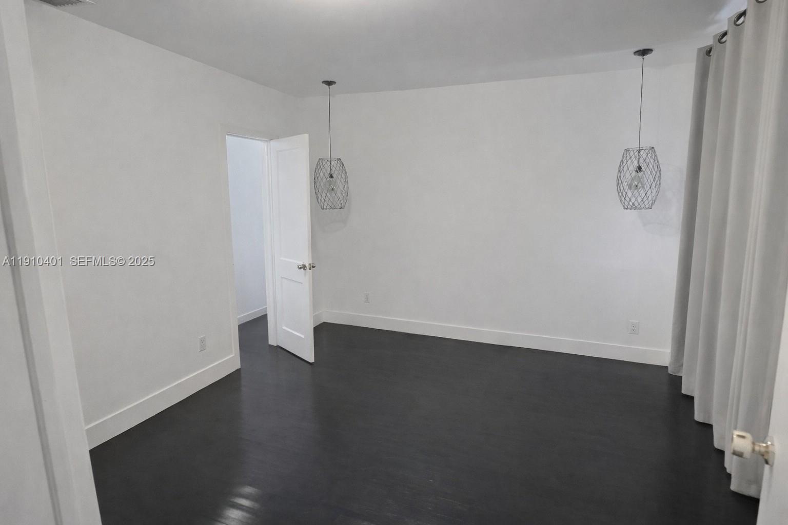 6541 Southwest 18th Street Miami, FL 33155 - Photo 10 of 22 a view of a room with wooden floor