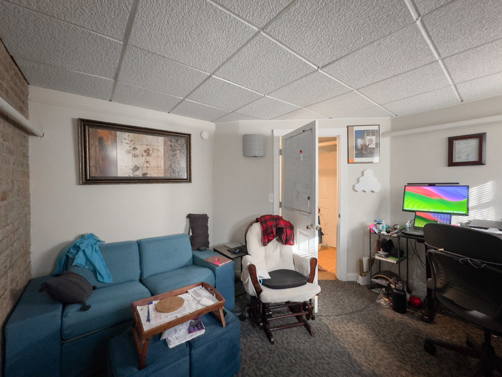 3701 North Racine Avenue, Unit GE Chicago, IL 60613 - Photo 18 of 20 a living room with furniture and a flat screen tv