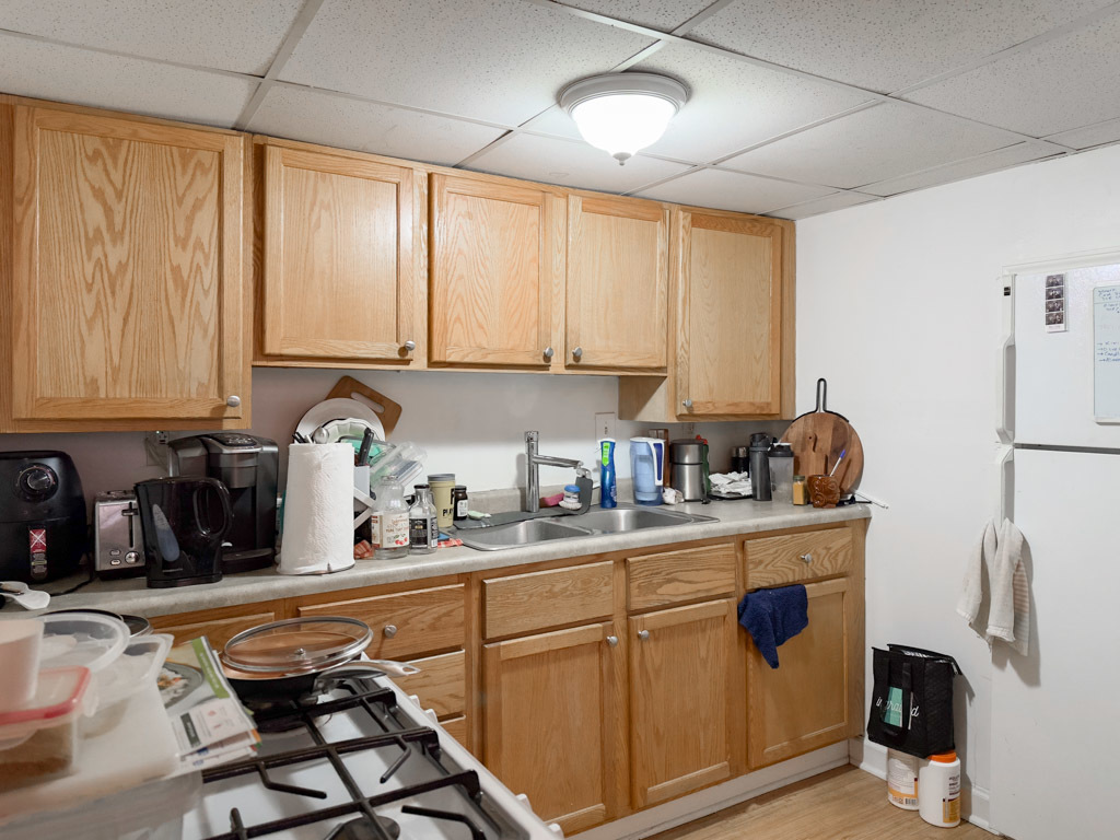 3701 North Racine Avenue, Unit GE Chicago, IL 60613 - Photo 2 of 20 a kitchen with a stove a sink a refrigerator and cabinets