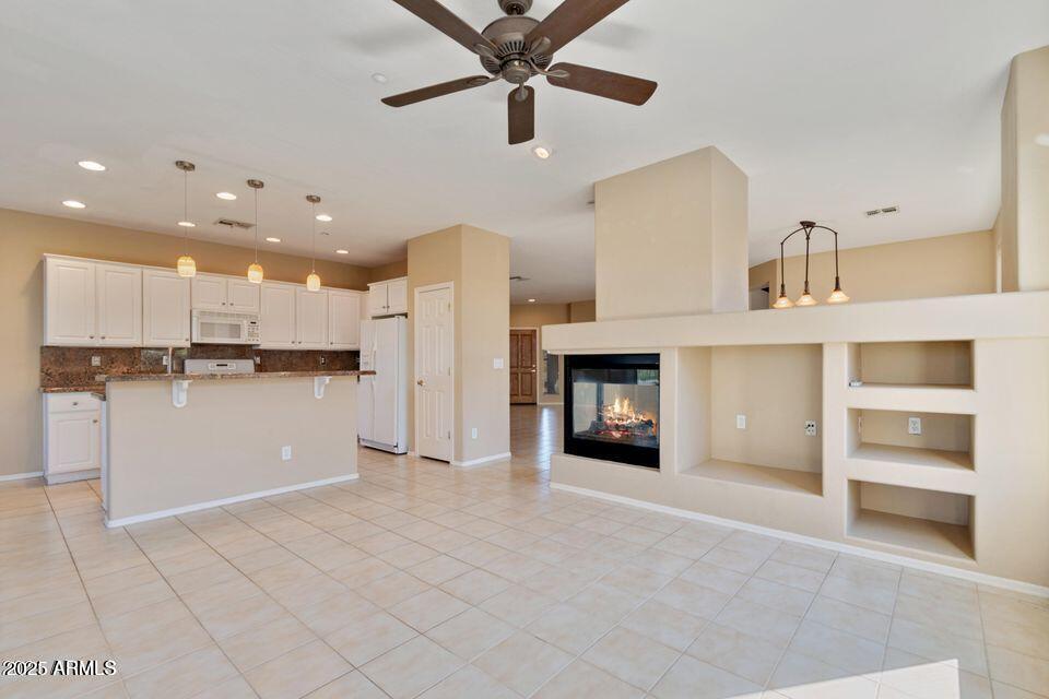 41526 North Cedar Chase Road Anthem, AZ 85086 - Photo 6 of 14 a view of a kitchen with a sink and a refrigerator