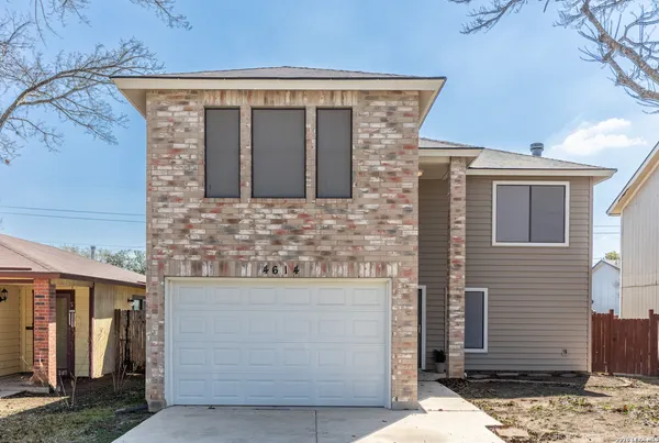 a front view of a house with stairs